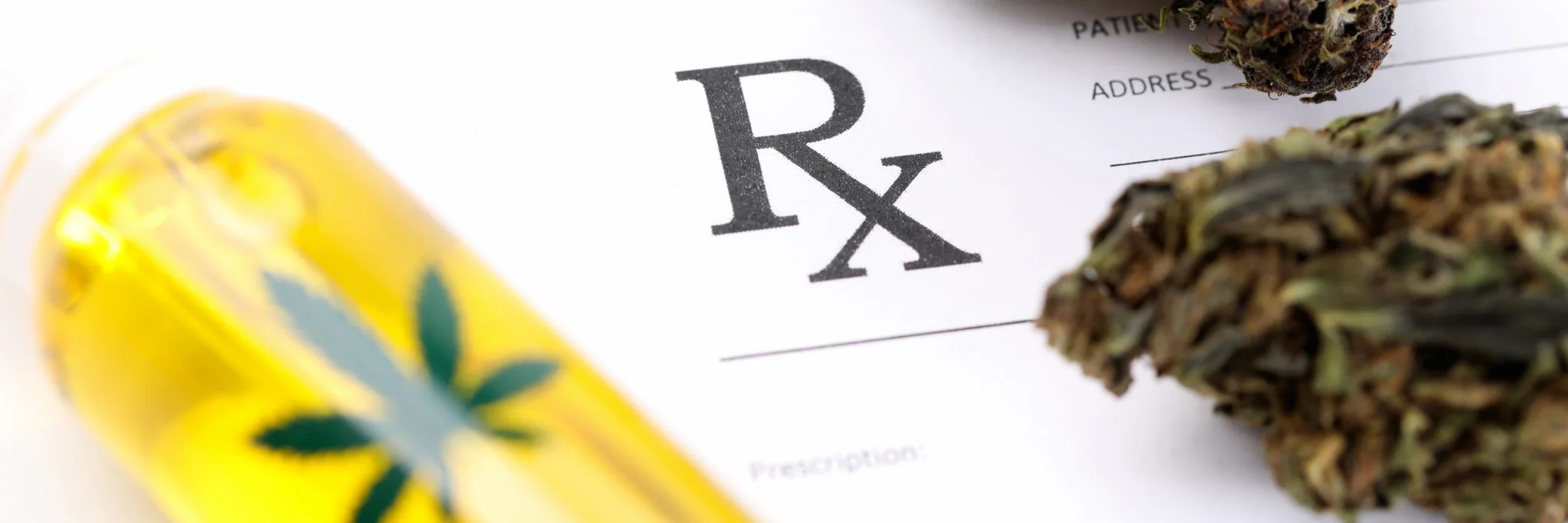 A picture of a prescription refill form with a marijuana nugget, and oil on top of it. 